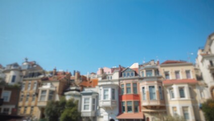 Colorful Balat houses with blue sky background, urban architecture, lively neighborhood, summer day, cultural heritage