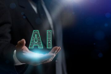 Businessman with AI Learning and Artificial intelligent. Man hand holding a glowing futuristic "AI" text, Smart robot science and artificial intelligence technology. Chat with AI