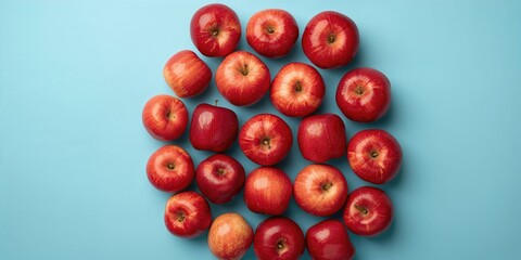 Back to school themed background with colored pencils, an apple, and gingerbread on a wooden table, educational setting for autumn season