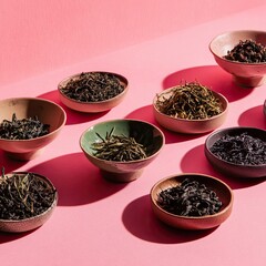 Assorted Loose Leaf Teas In Bowls On Pink Background