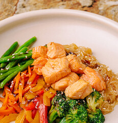 Healthy salmon dish with fresh vegetables in a clean setting