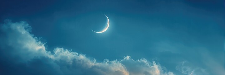 Moon and clouds in blue and yellow hues, atmospheric scene emphasizing tranquility and seasonal change