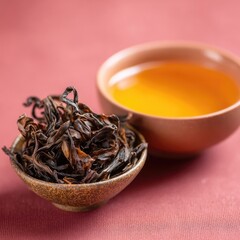 Dried Black Tea Leaves In Ceramic Teacup On Reddish Background