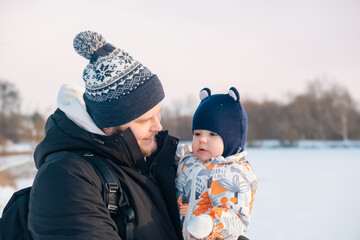 Father and Baby in Winter Landscape Copy Space