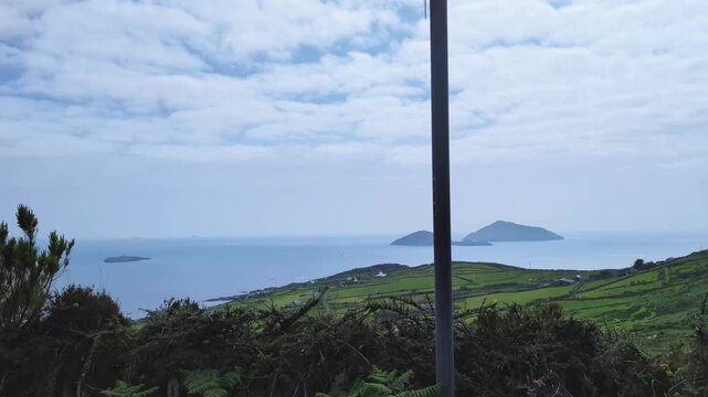 Car drive with a Scenic view of a Scarriff Island and emerald irish landscape, Ring of Kerry, Ireland
