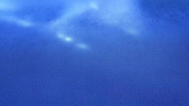 A blue textured background with soft cloud patterns, featuring an Adobe Stock watermark.