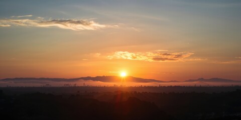 Obraz premium Vintage-inspired kitchen scene with a woman preparing a fruit-filled cake for a summer birthday celebration, emphasizing culinary creativity