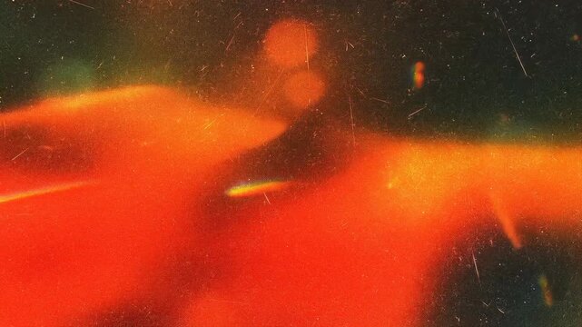 An abstract image with warm orange tones and a textured surface, evoking a feeling of warmth and calm.