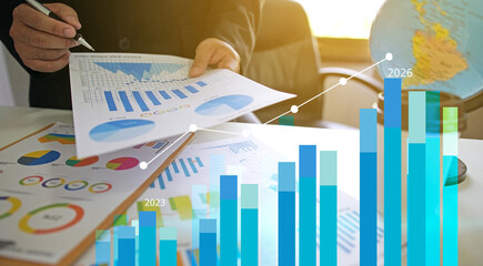 Businessman reviewing balance sheet and virtual data charts. financial analysis concept, strategy planning and growth opportunities, calculating company investment