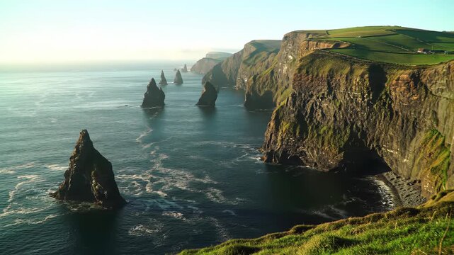 Irish cliffs & sea stacks scenic view, tranquil landscape with green fields for travel brochures