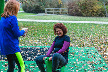 Mature women friends playing outdoor at park