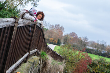 Mother and child enjoying an autumn park day