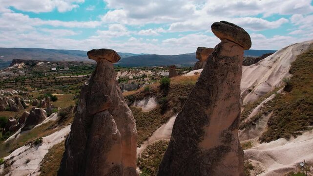 Aerial drone flying around &uuml;&ccedil; g&uuml;zeller fairy chimneys in cappadocia