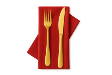 Gold fork and knife on red napkin dining place setting
