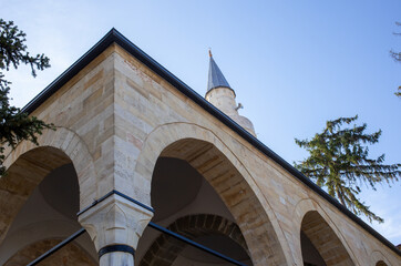 Stone arches and minaret of historic mosque in Tarakli Sakarya