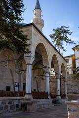 Historic mosque exterior with arches and minaret in Tarakli Sakarya