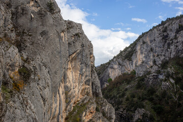 Rocky canyon passage under clear blue sky