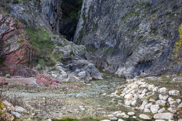 Rocky canyon entrance with textured stone terrain