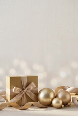 Christmas or New Year frame decorations gold colors on beige background with empty copy space for text. holiday and celebration concept for postcard or invitation.  . Aesthetic minimalist 