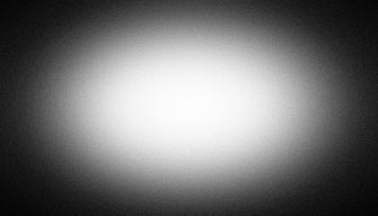 Black and white radial vignette gradient background. Central light glow. Soft blurred edges. Subtle noise grain texture. Smooth grayscale fade. Minimal monochrome light burst effect. PNG