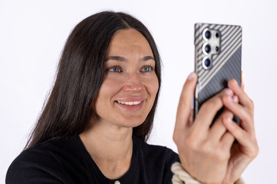 Womanis taking a selfie with her smartphone