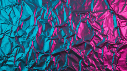 Wrinkled foil texture with vibrant pink and teal lighting