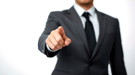 A professional individual in a suit pointing forward, creating a sense of direction and engagement