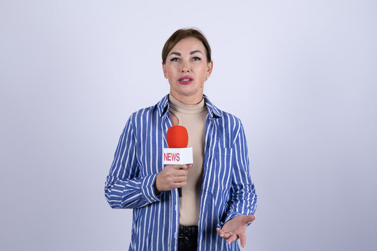 The reporter is presenting a news segment with a microphone - Powered by Adobe