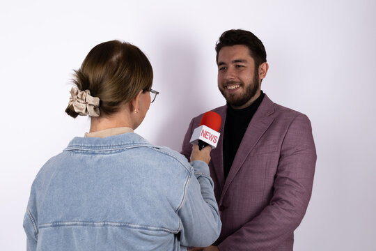 Man and woman talking in a crowded city square, surrounded by diverse group - Powered by Adobe