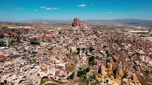 Aerial drone flying over uchisar castle in cappadocia turkey