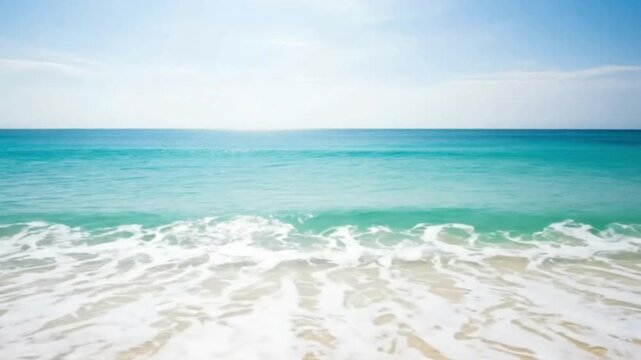 A stunning idyllic tropical ocean scene unfolds, showcasing crystal-clear turquoise waters gently rolling towards a pristine sandy shore. White foamy waves gracefully ebb and flow under a vast, bright