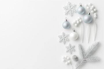 Christmas ornaments with snowflakes and a tree branch on a white background. Ideal for holiday themed designs and winter decorations.