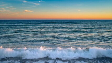 Wide view of gentle ocean waves lapping against shoreline during sunset featuring smooth water textures warm orange and blue hues in the sky creating a serene coastal atmosphere - Powered by Adobe