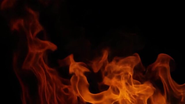 Dynamic flames dancing against a dark background showcasing vibrant orange and red hues with swirling shapes creating a mesmerizing visual of fire in motion.