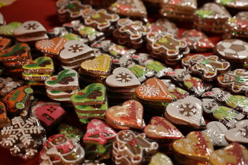 lose-up of various colorful, glazed gingerbread cookies with Christmas and winter designs for sale