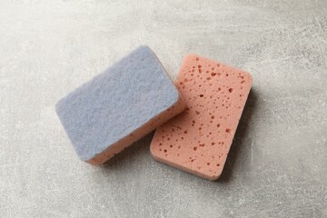 Clean kitchen sponges on grey table, top view