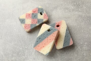 Clean kitchen sponges on grey table, flat lay