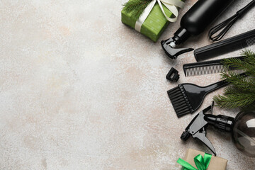 Obraz premium Hairdresser's tools and Christmas decor on color textured table, flat lay. Space for text