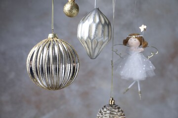 Obraz premium Beautiful Christmas decor hanging near light grey wall, closeup