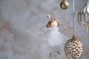 Obraz premium Beautiful Christmas decor hanging near light grey wall, closeup. Space for text
