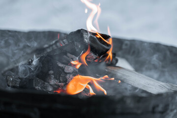 Enchanting Austrian Christmas market at night with glowing candles, crackling fire pits and festive...