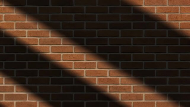Close-up of brick wall texture with natural lighting showing shadows cast on the surface highlighting the warm red tones and intricate patterns in a well-structured indoor setting