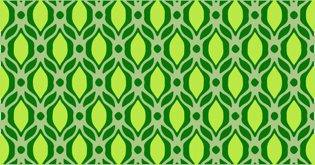 Green seamless pattern with symmetrical leaf-like shapes creating an organic decorative design.