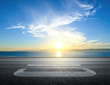 Road meets horizon; sunset over ocean, beautiful sky