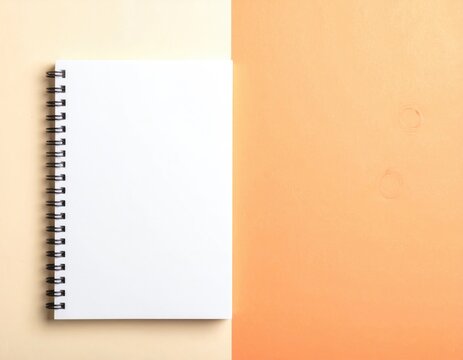 Open notebook on tan and orange background