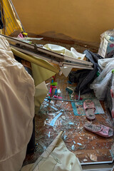 KYIV, UKRAINE - JUNE 6, 2025: Damage to the balcony of a residential building after a drone strike, showing broken windows and debris on the wall.