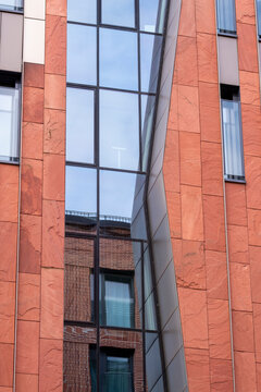 Vertical modern architecture emphasizing facade modules and pattern detail where geometry meets background hues and contrast within a balanced structure shaped by abstract design and urban texture