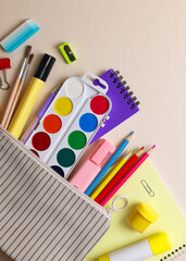 Back to School Supplies and Stationery on a Vibrant Background for a Fresh Start. Vertical photo format © Fotomoment001