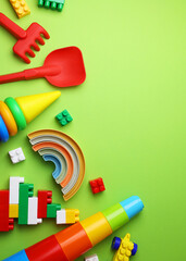 A vibrant display of childrens toys on a bright yellow backdrop, perfect for playful themes and joyful imagination. Vertical photo format