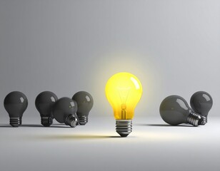 Lit bulb shines among unlit ones on a grey surface